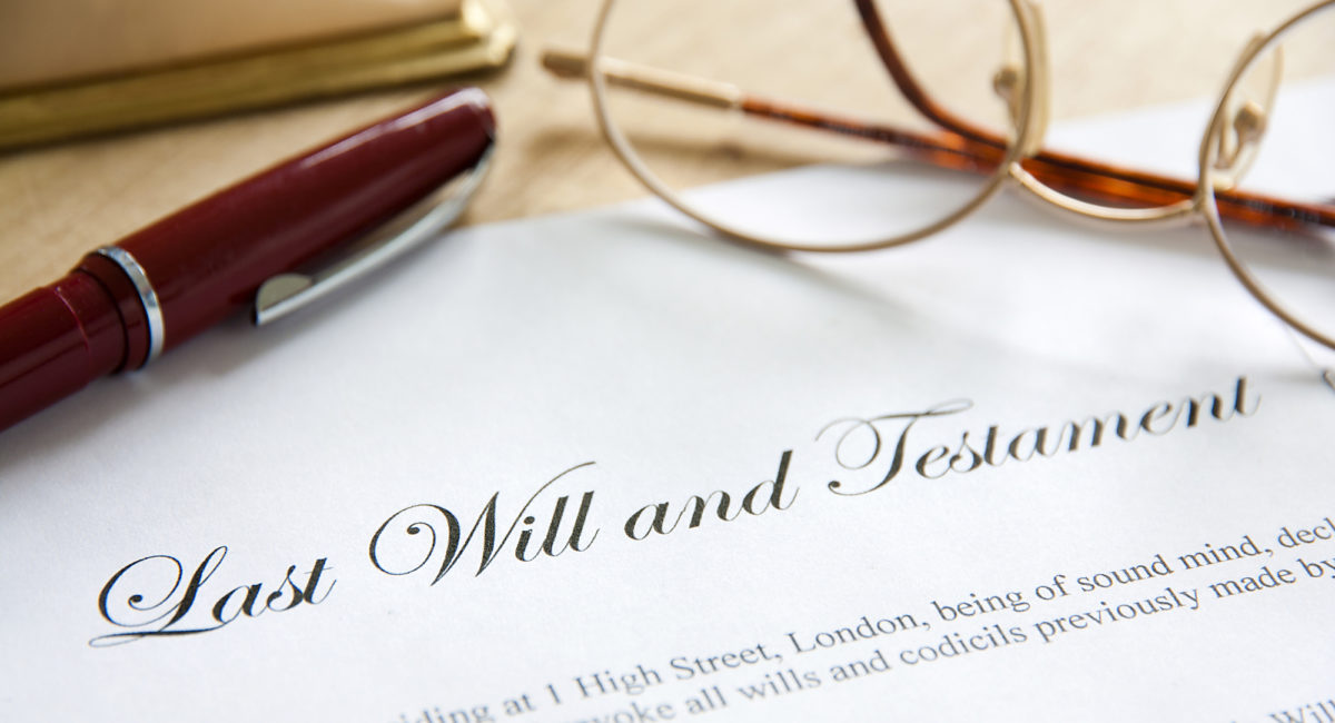 Common Reasons Why Probate Can Be Delayed - Last Will and Testament concept image complete with spectacles and pen.