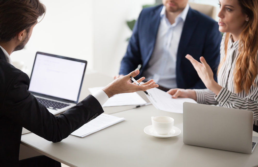 Corporation Meetings And Taking Minutes - Close up of business colleagues negotiate on contract conditions