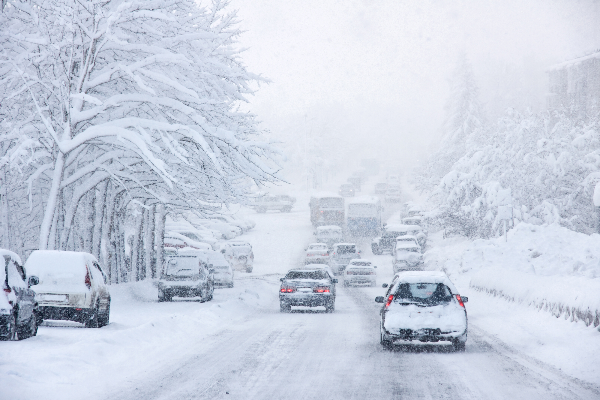 Bad Weather Driving: Risks & Safety - Snowstorm, poor visibility, slick roads and lots of traffic